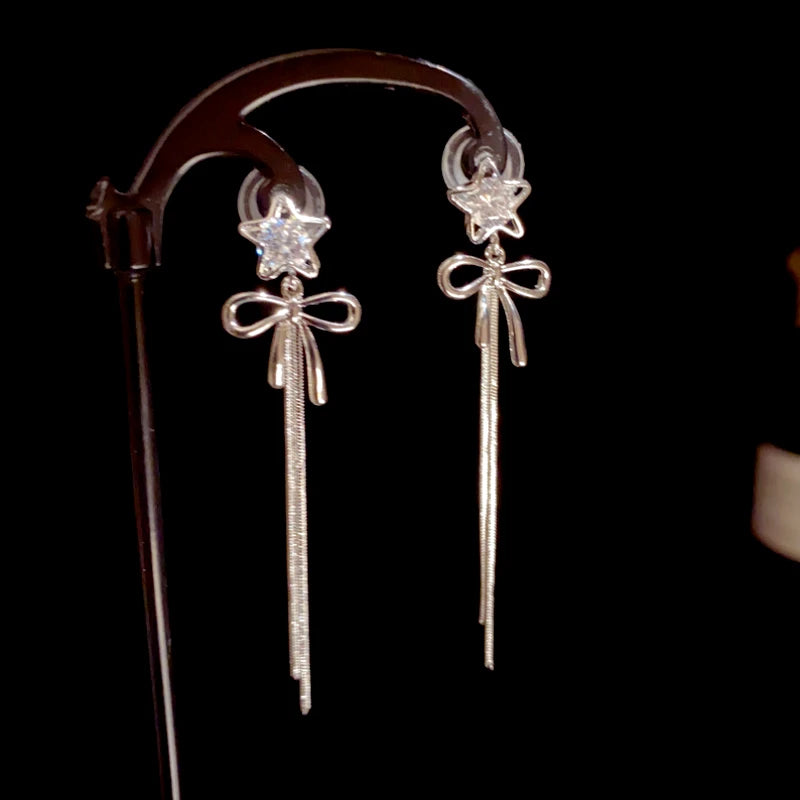 Close-up detail of the sparkling zircons and plating on the Bow Tassel Earrings