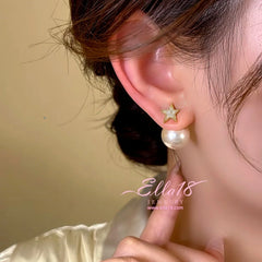 Model showcasing the dangle and style of the 14K Gold-Plated Zircon Star Pearl Earrings