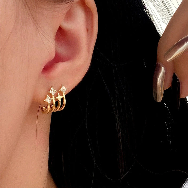 Close-up detail of the sparkling zircons and plating on the Star Stud Earrings