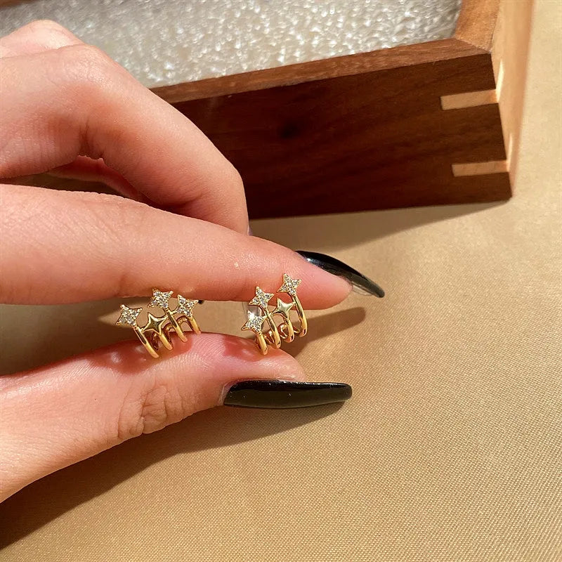 Angled view of the 14K Gold-Plated Zircon Star Stud Earrings