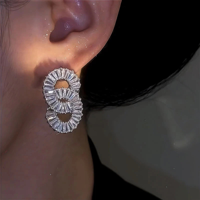 Model showcasing the dangle and style of the 14K Gold-Plated Zircon String Earrings