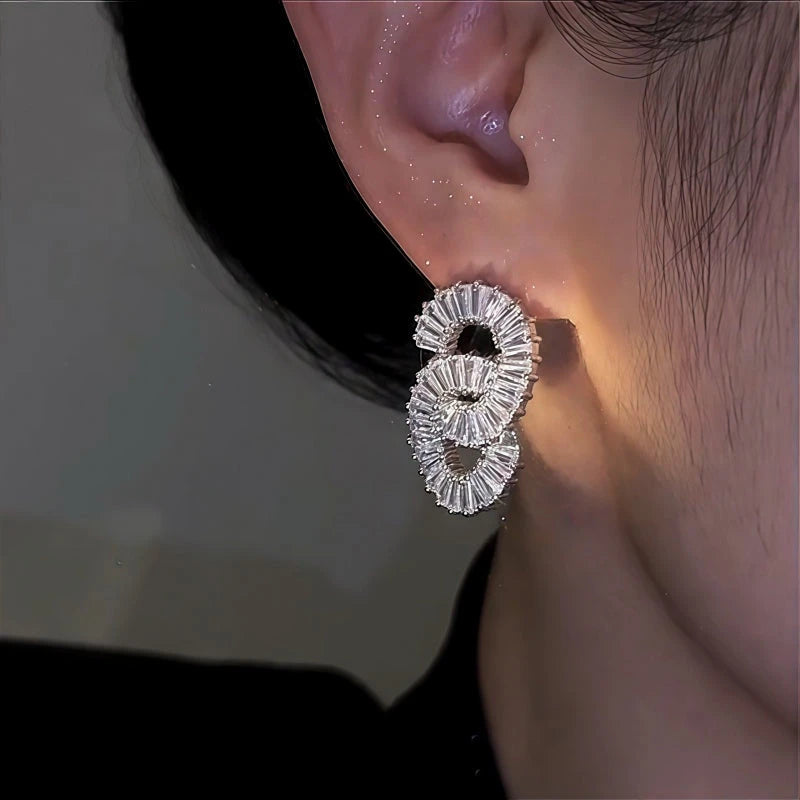 Close-up detail of the sparkling zircons and plating on the String Earrings