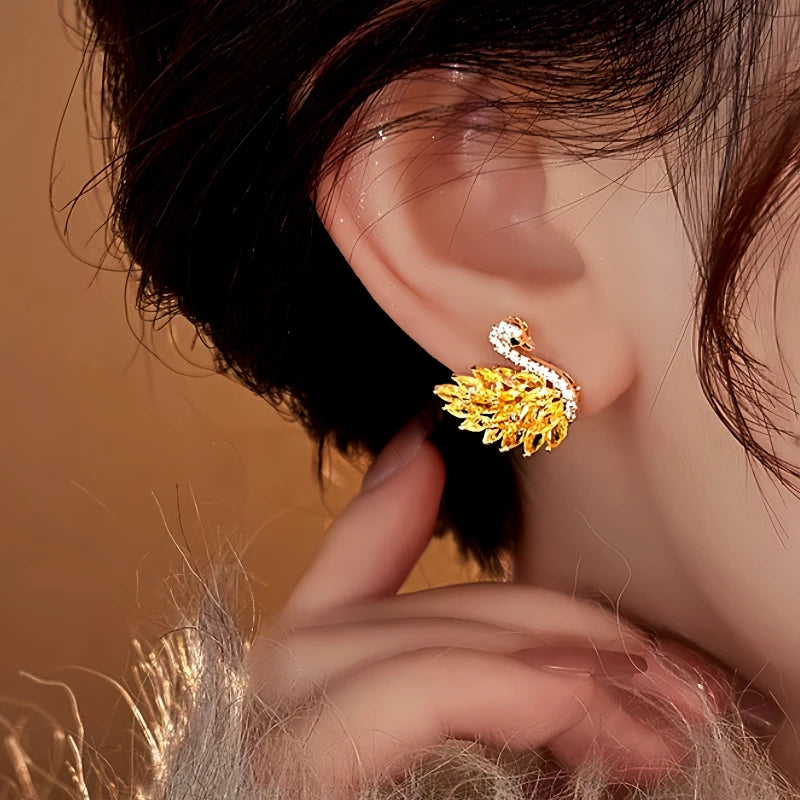 Close-up detail of the sparkling zircons and plating on the Swan Stud Earrings