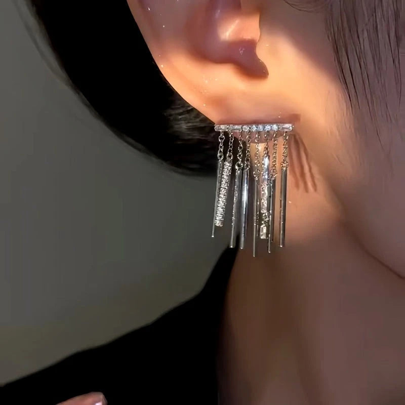Model showcasing the dangle and style of the 14K Gold-Plated Zircon Tassel Earrings