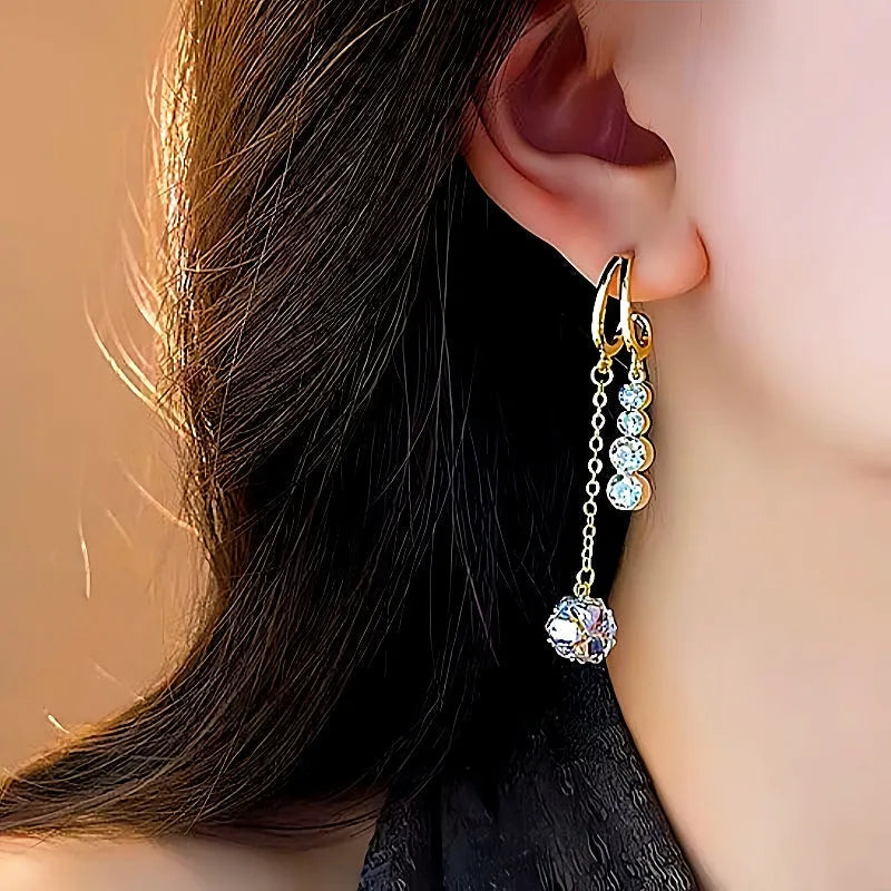 Model showcasing the dangle and style of the 14K Gold-Plated Zircon Tassel Earrings