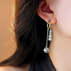 Model showcasing the dangle and style of the 14K Gold-Plated Zircon Tassel Earrings