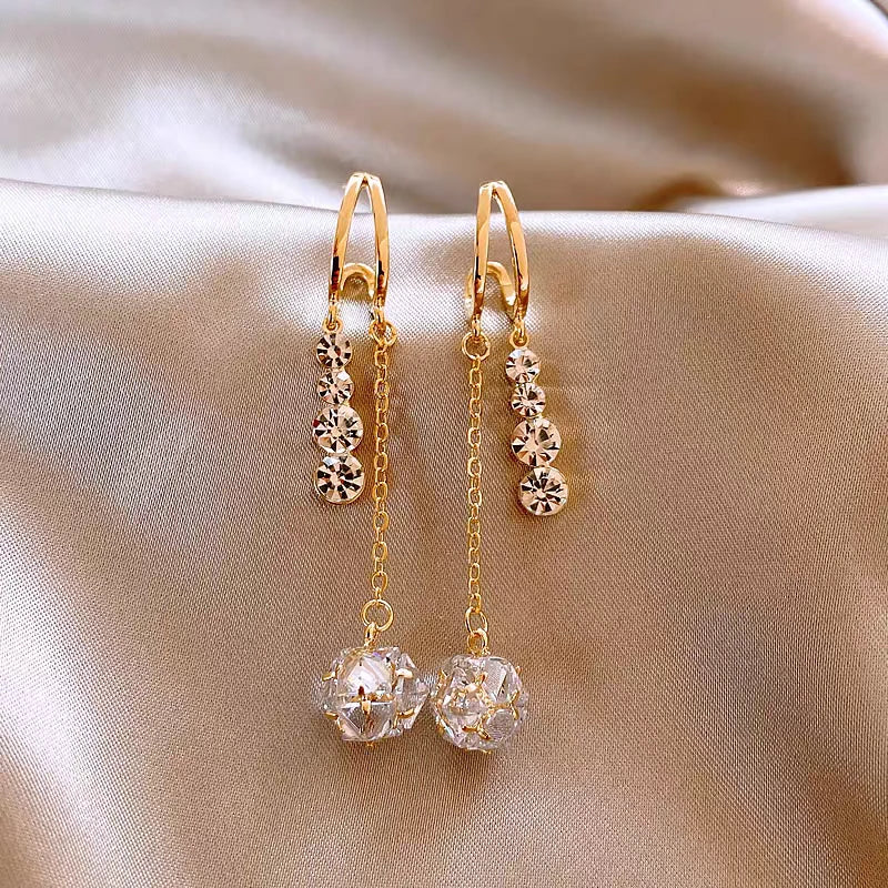 Angled view of the 14K Gold-Plated Zircon Tassel Earrings
