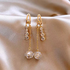 Angled view of the 14K Gold-Plated Zircon Tassel Earrings