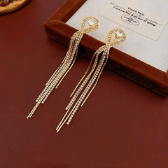 Close-up detail of the sparkling zircons and plating on the Tassel Earrings