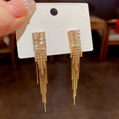 Close-up detail of the sparkling zircons and plating on the Golden Tassel Earrings