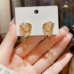 Close-up detail of the sparkling zircons and plating on the Tassel Earrings
