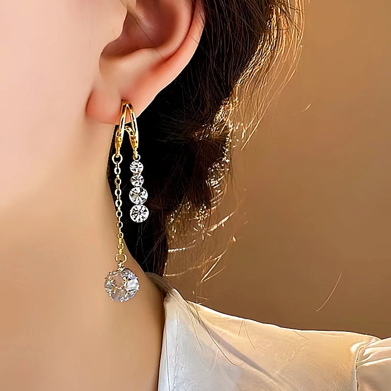 Close-up detail of the sparkling zircons and plating on the Tassel Earrings