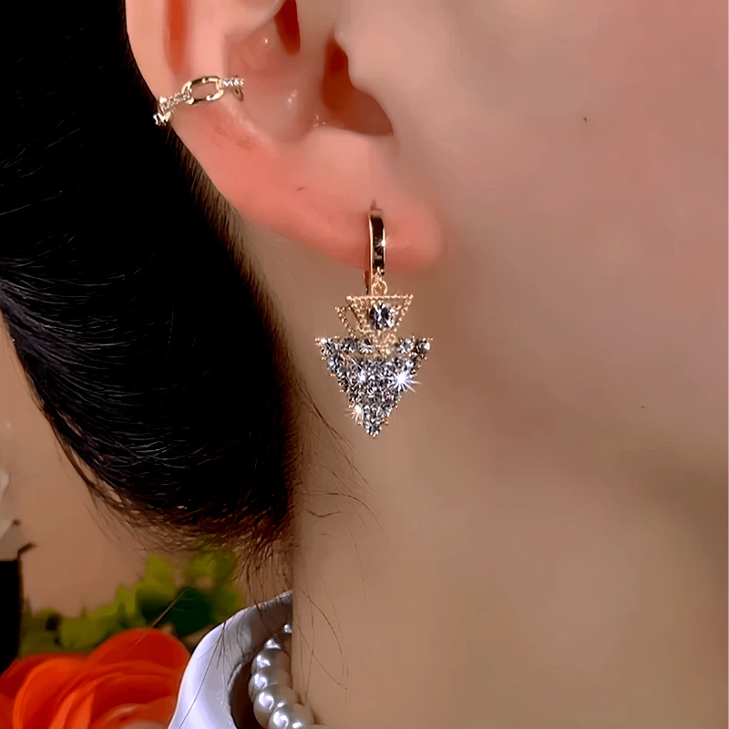 Close-up detail of the sparkling zircons and plating on the Triangular Diamond Earrings