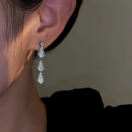 Model showcasing the dangle and style of the 14K Gold-Plated Zircon Water Drop Earrings