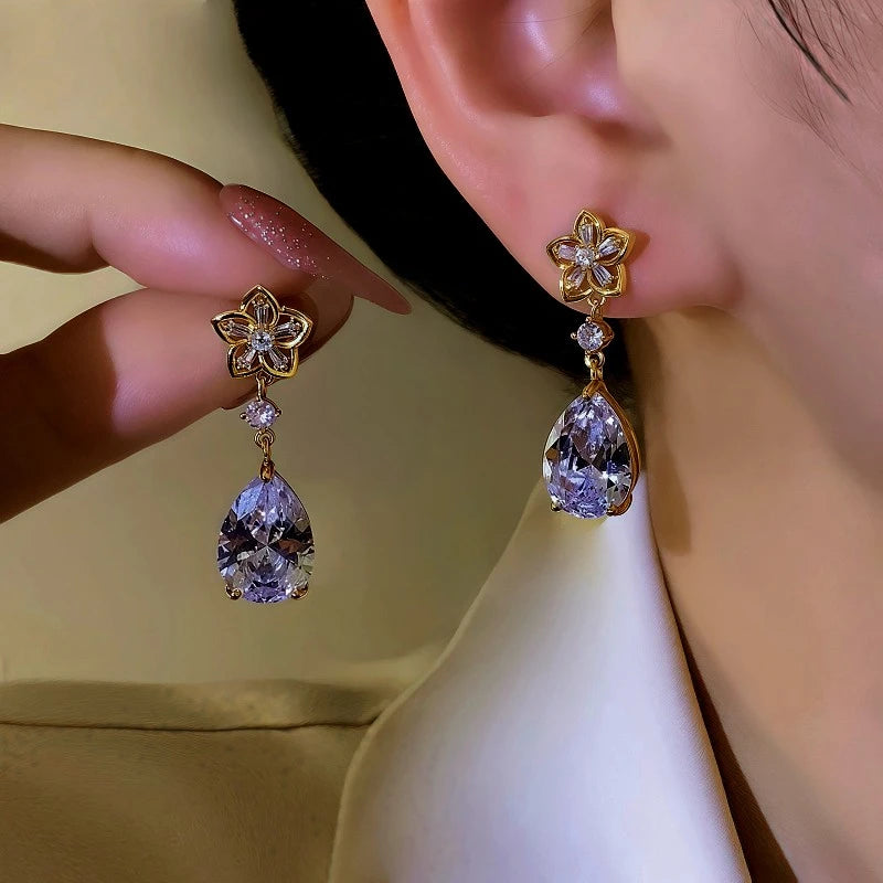 Women's Gold Flower Light Purple Teardrop Crystal Dangle Earrings on Ear