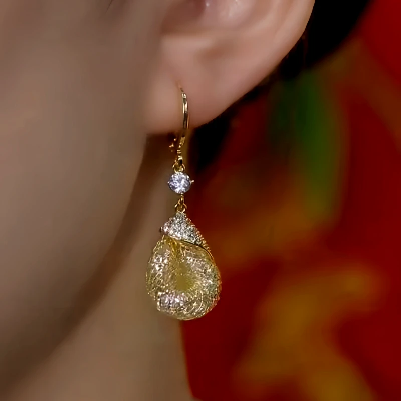 Close-up detail of the sparkling zircons and plating on the Water Drop Earrings