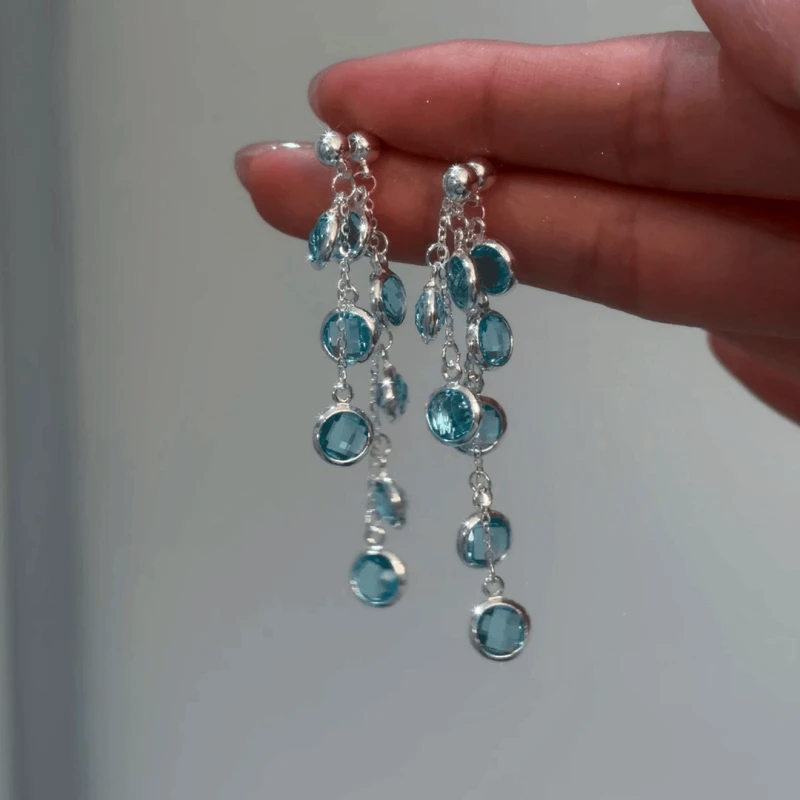 Angled view of the 14K Gold-Plated Zircon Water Drop Tassel Earrings