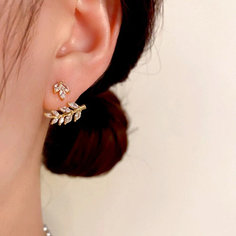 Model showcasing the dangle and style of the 14K Gold-Plated Zircon Wheat Earrings