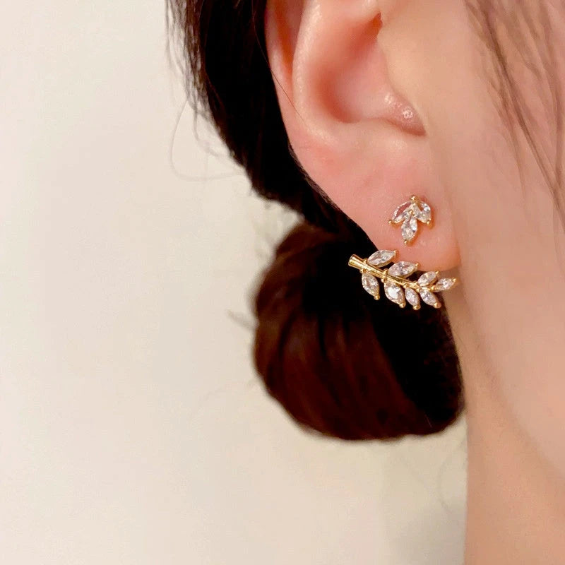 Angled view of the 14K Gold-Plated Zircon Wheat Earrings