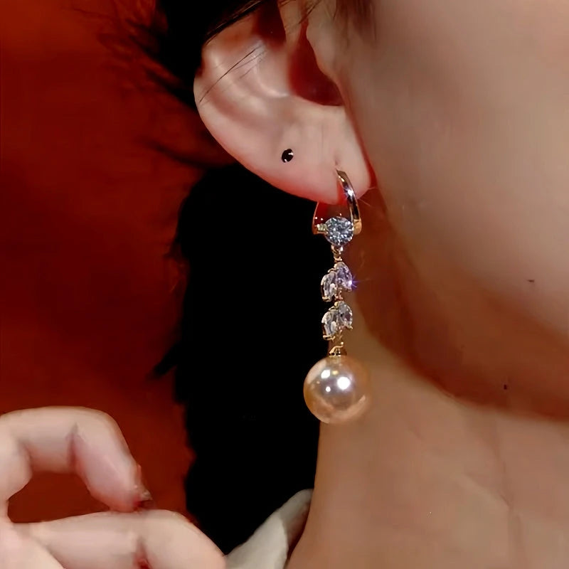Angled view of the 14K Gold-Plated Zircon Wheat Pearl Earrings