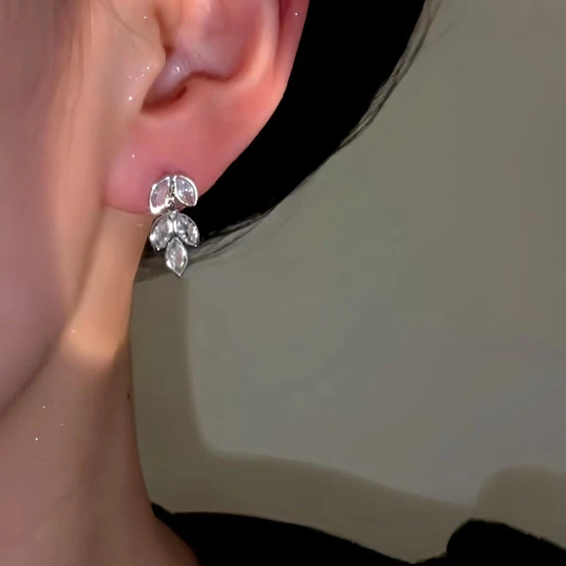 Angled view of the 14K Gold-Plated Zircon Wheat Tassel Earrings