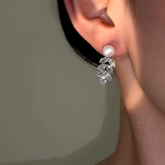 Close-up detail of the sparkling zircons and plating on the Pearl Earrings