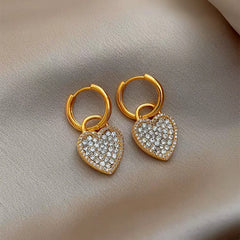 Close-up detail of the sparkling zircons and plating on the Gold Heart Earrings