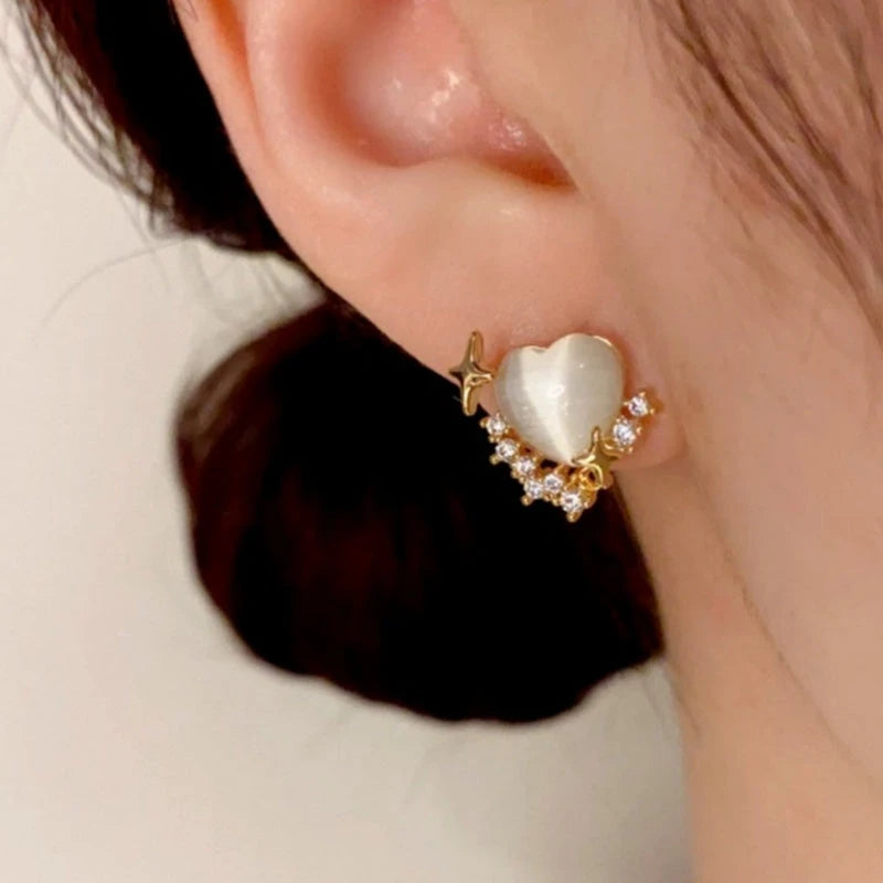 Angled view of the 14K Gold-Plated Zircon & Cat's Eye Stone Heart Stud Earrings