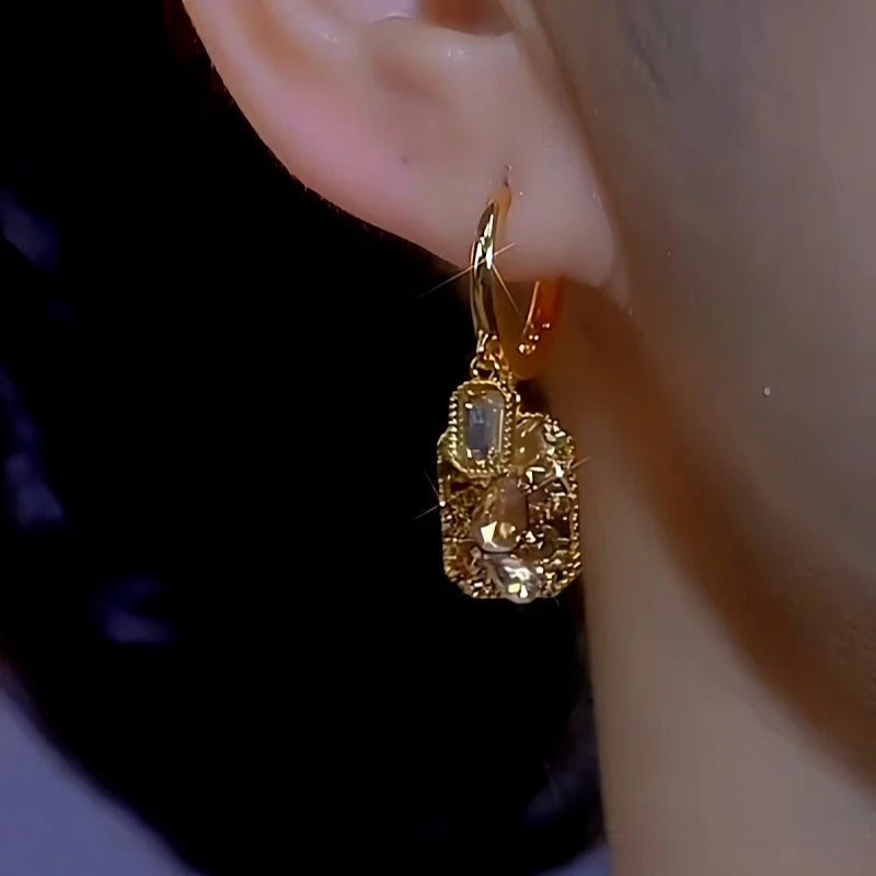 Close-up detail of the sparkling zircons and plating on the Square Earrings