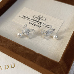 Angled view of the 14K Gold-plated Butterfly Bead Earrings