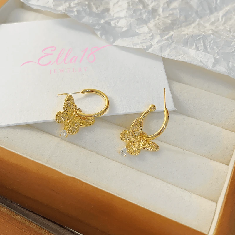 Angled view of the 14K Gold-plated Butterfly Pendant Earrings
