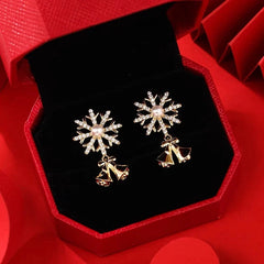 Angled view of the 14K Gold-plated Christmas Diamond Snowflake Bell Earrings