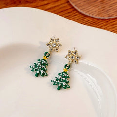 Angled view of the 14K Gold-plated Christmas Diamond Zircon Snowflake Christmas Tree Earrings