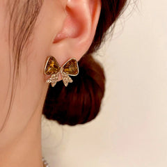 Close-up detail of the sparkling zircons and plating on the Brown Diamond Bow Earrings