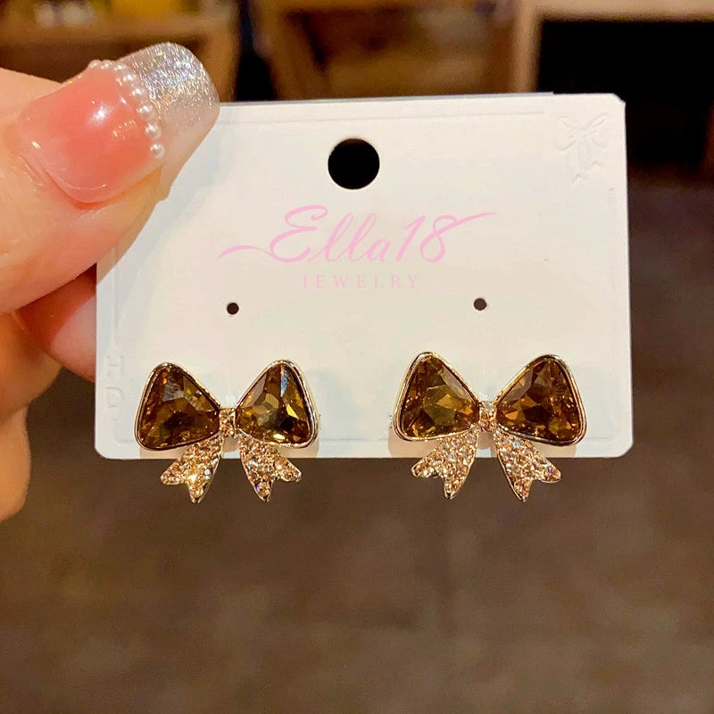 Angled view of the 14K Gold-plated Diamond Bow Earrings