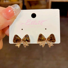 Angled view of the 14K Gold-plated Diamond Bow Earrings