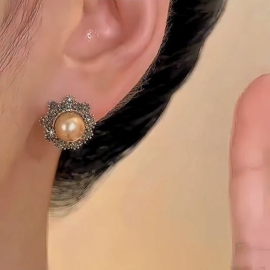 Model showcasing the dangle and style of the 14K Gold-plated Diamond Champagne Pearl Earrings