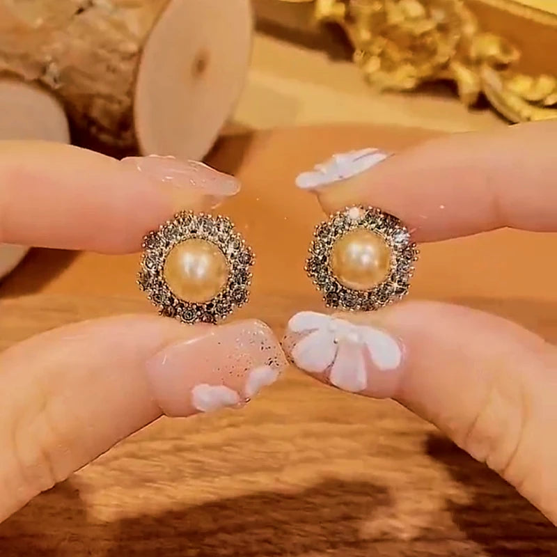 Close-up detail of the sparkling zircons and plating on the Champagne Pearl Earrings