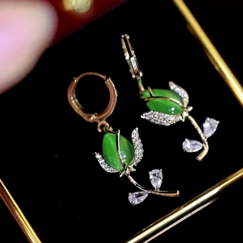Angled view of the 14K Gold-plated Diamond Green Tulip Earrings
