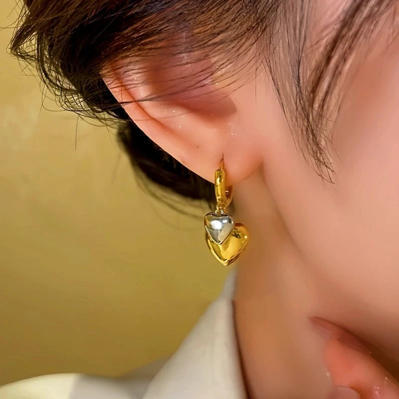 Close-up detail of the sparkling zircons and plating on the Double-Layer Heart Earrings