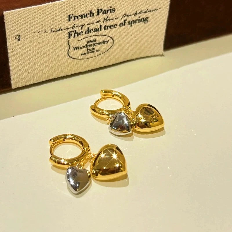 Angled view of the 14K Gold-plated Double-Layer Heart Earrings