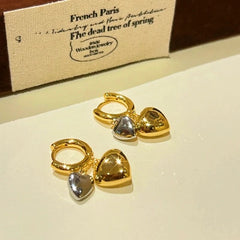 Angled view of the 14K Gold-plated Double-Layer Heart Earrings