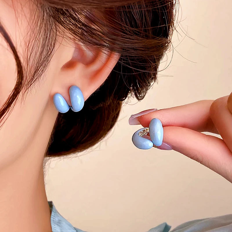 Angled view of the 14K Gold-plated Double C Earrings