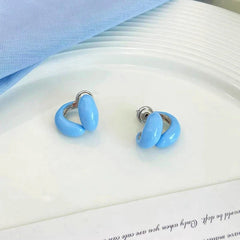 Close-up detail of the sparkling zircons and plating on the Double C Earrings