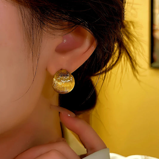 Model showcasing the dangle and style of the 14K Gold-plated Elegant Brushed C-Shaped Earrings