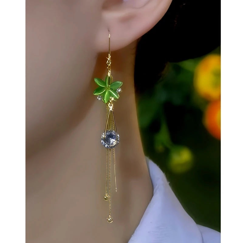Model showcasing the dangle and style of the 14K Gold-plated Elegant Green Opal Flower Threader Earrings