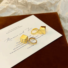 Close-up detail of the sparkling zircons and plating on the Gold Square Earrings