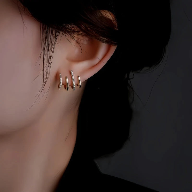 Model showcasing the dangle and style of the 14K Gold-plated Elegant Studs