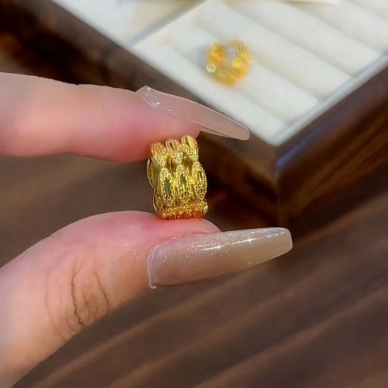 Angled view of the 14K Gold-plated Elegant Three-Layer Hoop Earrings