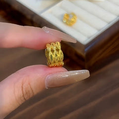 Angled view of the 14K Gold-plated Elegant Three-Layer Hoop Earrings